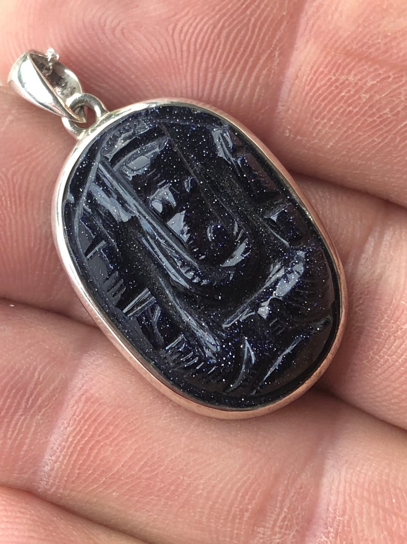 The God of all Beginings Blue Goldstone Carved Ganesha Elephant Head design 925 Sterling Silver Pendant.