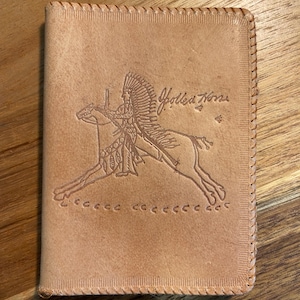 May include: A set of three ceramic mugs with a speckled, matte finish. The mugs are in shades of blue, green, and white. Each mug has a rounded handle and a slightly flared rim. The mugs are stacked on top of each other.