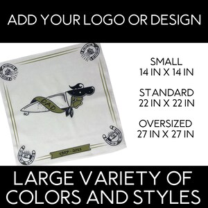 May include: A white bandana with a green border and a knife tattoo with the word "DAD" on it. The bandana has a horseshoe and eye design in each corner. The bandana is available in three sizes: 14 inches by 14 inches, 22 inches by 22 inches, and 27 inches by 27 inches.
