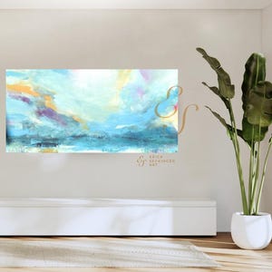 May include: A rectangular abstract painting featuring a blend of light blue, white, yellow, and purple brushstrokes. The artwork displays a horizontal composition with layered colors and a watermark reading Erica Seckinger Art in the center.