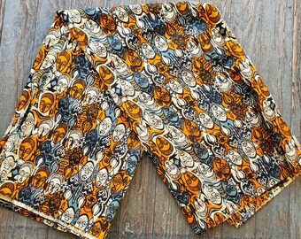 Multicolored African cotton mask print fabric sold by the yard