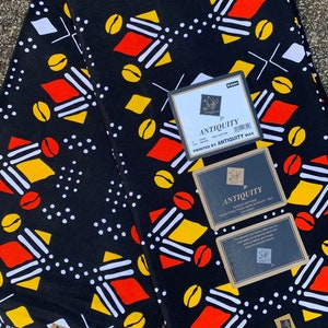 Red, Black, and Gold African print cotton fabric sold by the yard