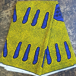 Yellow and blue African finger and hand print cotton fabric sold by the yard with kente cloth patterns