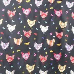 May include: Black fabric with a repeating pattern of colorful chickens and butterflies. The chickens are stylized and have a variety of patterns and colors. The butterflies are also stylized and have a variety of colors.