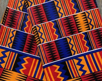 Orange and red kente cloth design with blue details cotton fabric sold by the yard from Mali, West Africa