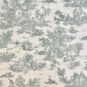 May include: A white fabric with a repeating pattern of green pastoral scenes. The pattern features people, trees, houses, and animals in a countryside setting.