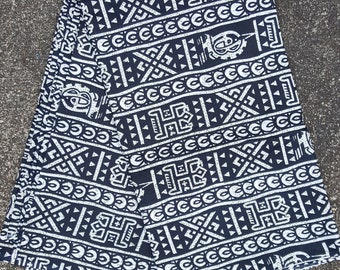 Black and Green stripe African print cotton fabric with figures from Mali sold by the yard