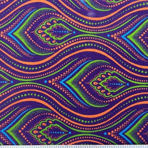 May include: Purple fabric with a repeating pattern of orange, green, and blue wavy lines and dots. The fabric is measured with a ruler in inches.