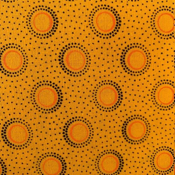 3 Cats gold shweshwe fabric  with black and orange circles from South Africa sold by the HALF meter. Shipped from USA