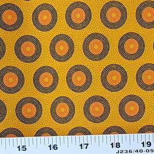 Da Gama gold, orange, and black circle shweshwe fabric from South Africa priced by the HALF meter - quilting, apparel, decorating