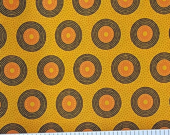 Da Gama gold, orange, and black circle shweshwe fabric from South Africa priced by the HALF meter - quilting, apparel, decorating