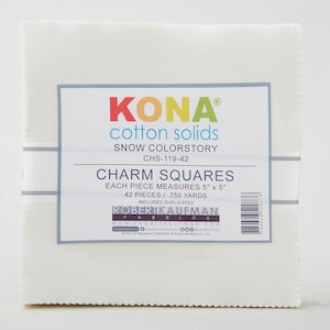 May include: A stack of white Kona Cotton Solids charm squares. Each square measures 5" x 5". The label reads "KONA cotton solids" and "Charm Squares". The package contains 42 pieces.