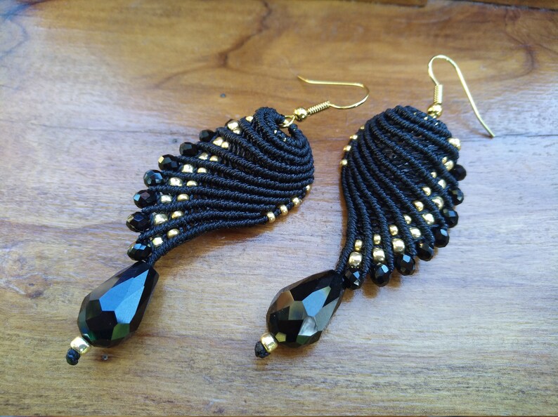 Black and golden macram\u00e8 earrings in wings shape