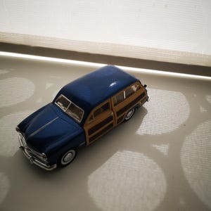 May include: A white ceramic mug with a black handle and the text "But First, Coffee" in a black, bold font. The mug is on a white surface. The mug is 4 inches tall.