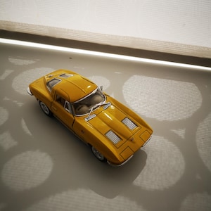 Chevrolet Corvette 1963, metal toy car model. Lovely collectible item!