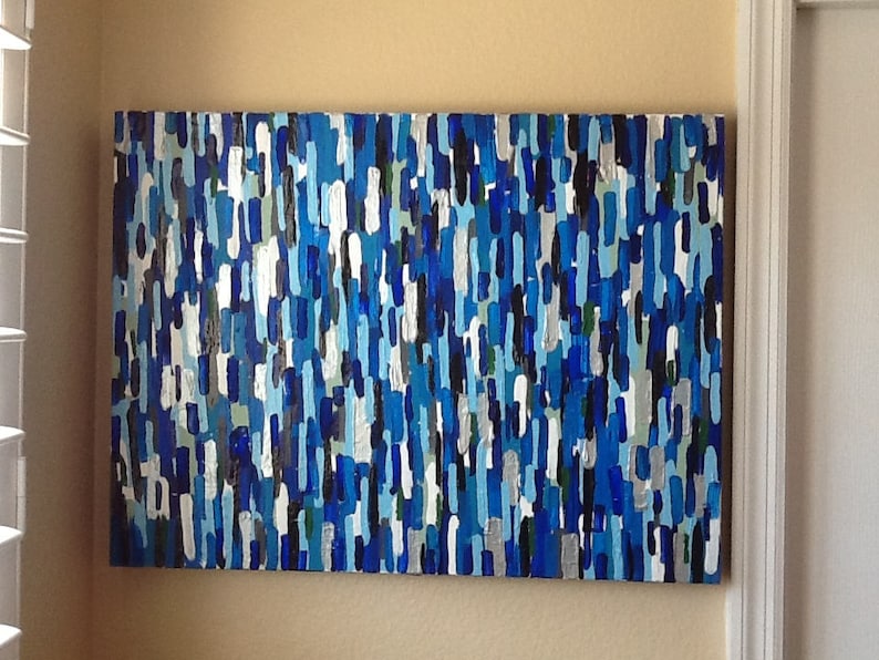 May include: Abstract painting featuring a blue, white and black colour scheme. The painting is composed of numerous vertical lines of varying widths and lengths.