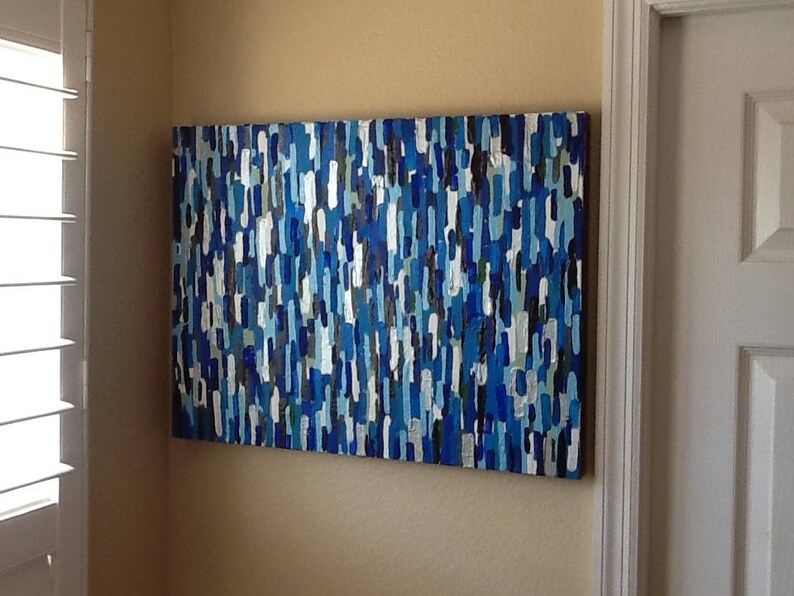 May include: Abstract painting featuring a blue, white and grey colour scheme. The painting is composed of numerous small, vertical lines.