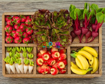 May include: A wooden crate filled with miniature food items, including red tomatoes, green lettuce, red radishes, white radishes, red apples, and yellow bananas.