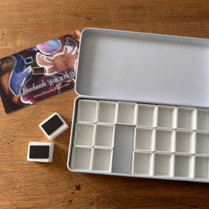 Empty watercolor tin palette perfect for travel with empty pans white enamel