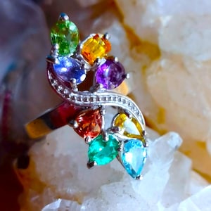 2,5 cm. long ring size 7 1/2 with antural apatite,blue topaz,citrine,tanzanite,peridot amethyst 925 silver sterling