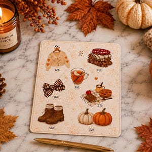 May include: A rectangular sticker sheet featuring autumn-themed illustrations including a cream cardigan with hearts, a stack of folded blankets, a brown plaid bow, a glass of cider, a picnic scene with a pie, brown boots, and two pumpkins, each labeled $20.