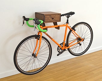 The Clifton Bike Rack - Stylish wall mount indoor bike shelf in walnut with drawer for accessories and bike gear.