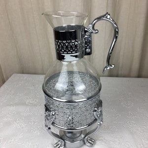 Vintage silverpläterad och glaskaraff och värmeställ saknar lock 04282