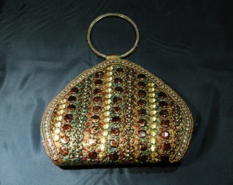 A Small Hard Side Purse with 1 Side Decorated Round Jeweled Handle 6 by 7 1/2 Inch     03872