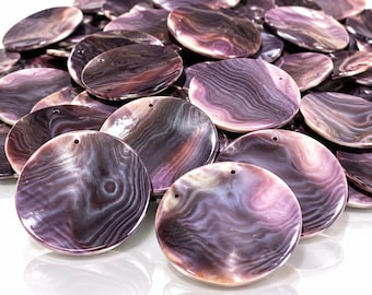 May include: A collection of circular, flat shell components featuring a polished, iridescent surface with swirling patterns in shades of deep purple, lavender, and white. Each piece has a small, singular hole drilled near the top edge for attachment.