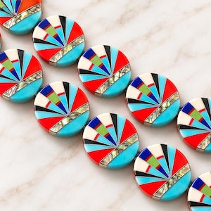 May include: A strand of circular beads featuring a radial inlay pattern. Each bead displays segments of bright red, turquoise blue, white, black, lime green, and dark blue, accented by a strip of iridescent abalone shell in a fan-like arrangement.