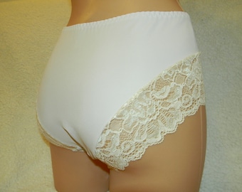 May include: White underwear with a lace trim. The lace is a cream color and has a delicate floral pattern.