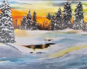 May include: A painting of a snowy winter scene with a frozen lake in the foreground and a line of snow-covered evergreen trees in the background. The sky is a vibrant orange and yellow, suggesting a sunset.