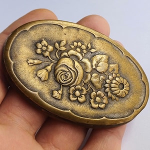 Antique brass trinket pill box with embossed flowers