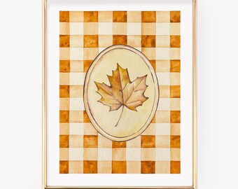 Stampa artistica da parete autunnale, con foglie autunnali e decorazione a quadretti arancioni.
