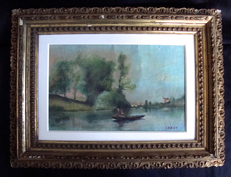 Puede incluir: Pintura de paisaje enmarcada, que representa una escena de r&iacute;o con un bote, &aacute;rboles y un edificio a lo lejos. La pintura est&aacute; firmada "Corot" y est&aacute; enmarcada en un marco dorado ornamentado.