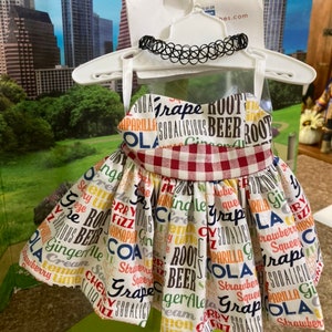 18 inch doll graphic logo soda pop 60s inspired sleeveless pleat ruffle dress with red black knee-high faux leather boots & choker necklace