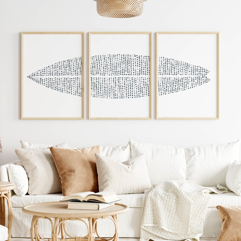 May include: Three framed prints with a white background and a black and white abstract design of a curved shape made of small dots.