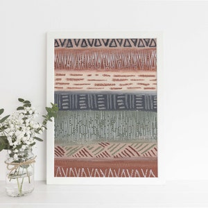 May include: A framed print with a geometric pattern in shades of brown, green, and gray. The pattern is made up of triangles, lines, and dots.
