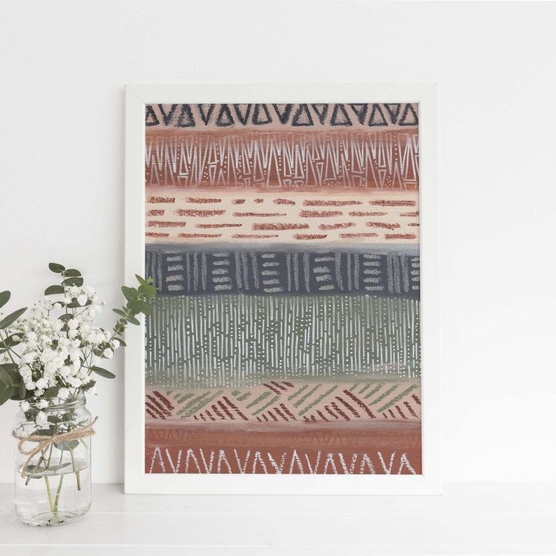 May include: A framed print with a geometric pattern in shades of brown, green, and gray. The pattern is made up of triangles, lines, and dots.