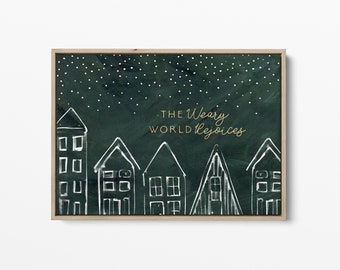 May include: A framed art print featuring a dark green background with white stars and white line-drawn houses. The text "The Weary World Rejoices" is in gold script. The artwork has a wooden frame.