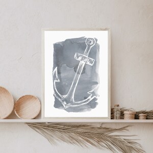 May include: A white anchor illustration on a gray watercolor background. The anchor is a nautical symbol of hope and strength.