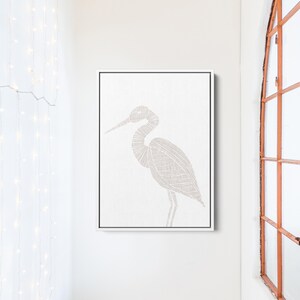 May include: A white canvas print with a detailed line drawing of a heron in a light gray color.