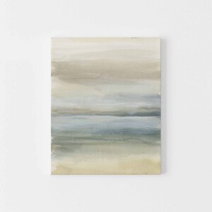 May include: Abstract painting with horizontal brushstrokes in shades of beige, blue, and green. The painting evokes a calming seascape with layers of color representing the sky, water, and sand.
