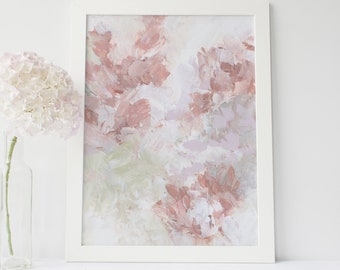 May include: Abstract art print in a white frame with a pink and green color scheme. The print features a soft, painterly style with brushstrokes and layers of color.