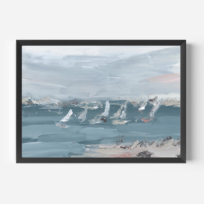May include: A framed abstract painting of a seascape with white sailboats in the distance. The sky is a light blue with hints of pink and the water is a darker blue. The painting is framed in black.