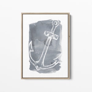 May include: A framed watercolor painting of a white anchor on a gray background.