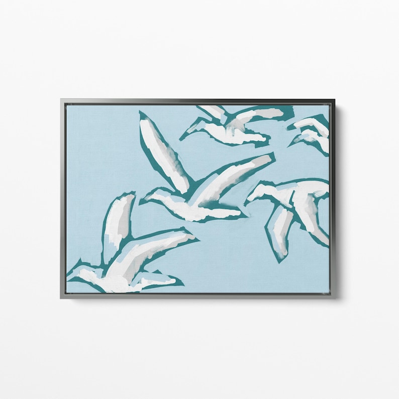 May include: A framed abstract painting of white birds flying in a teal blue sky.
