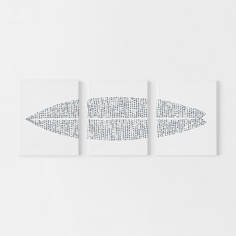 May include: Three white canvases with a black and white abstract design of a dotted pattern in the shape of a leaf. The design is repeated on each canvas.