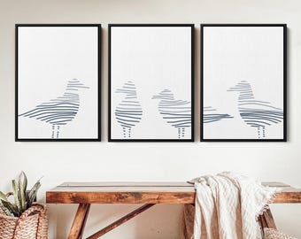 May include: Three black framed prints with white backgrounds and abstract line drawings of seagulls in shades of gray.
