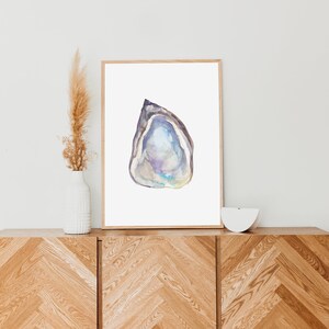 May include: Watercolor painting of a purple and blue oyster shell on a white background.